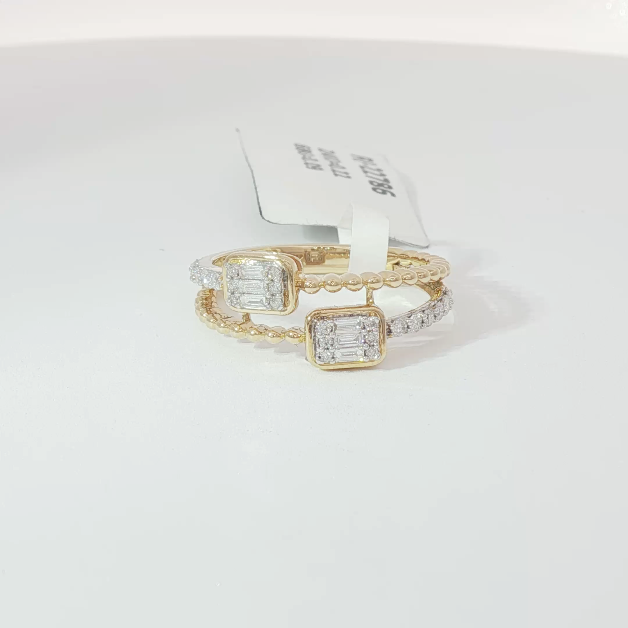 Double emerald diamond ring