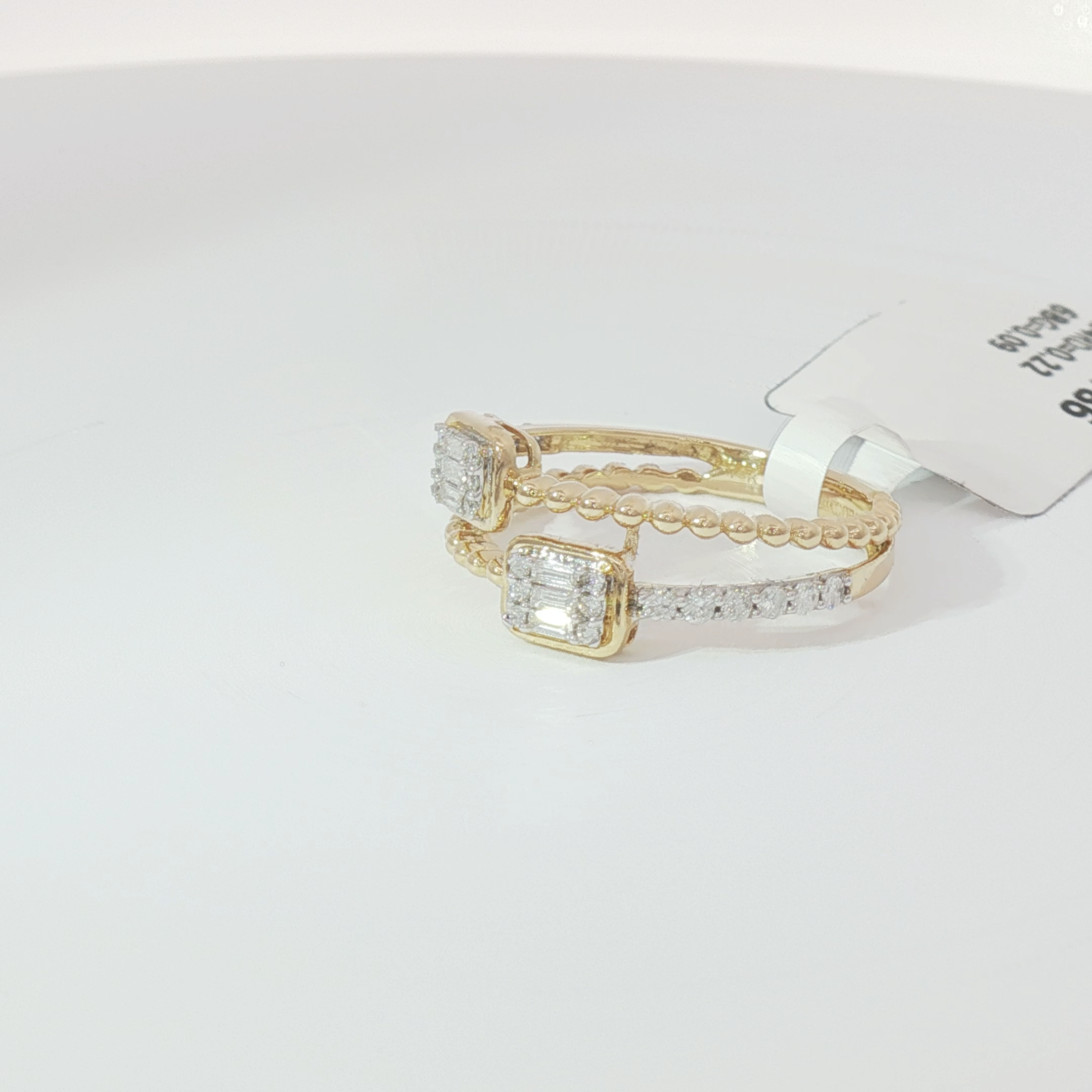 Double emerald diamond ring