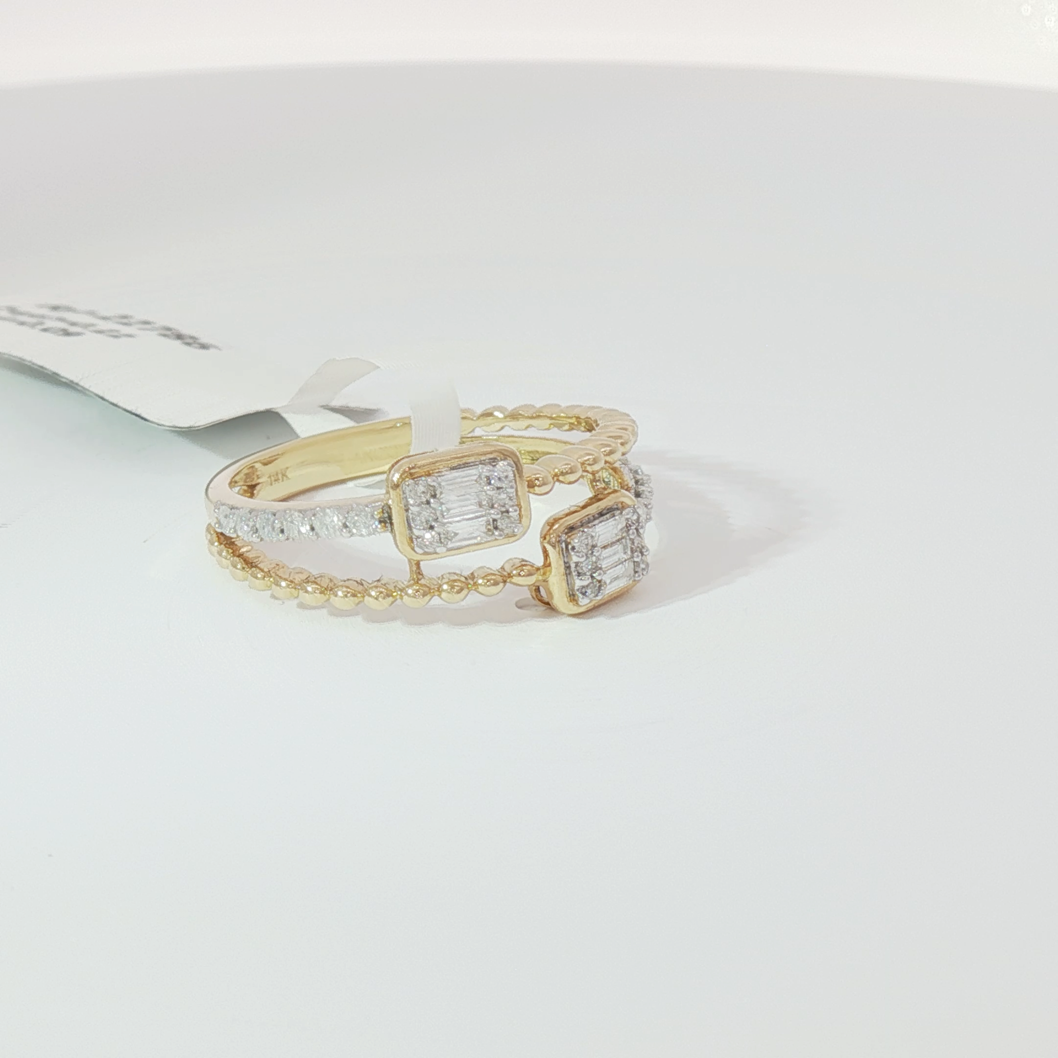 Double emerald diamond ring
