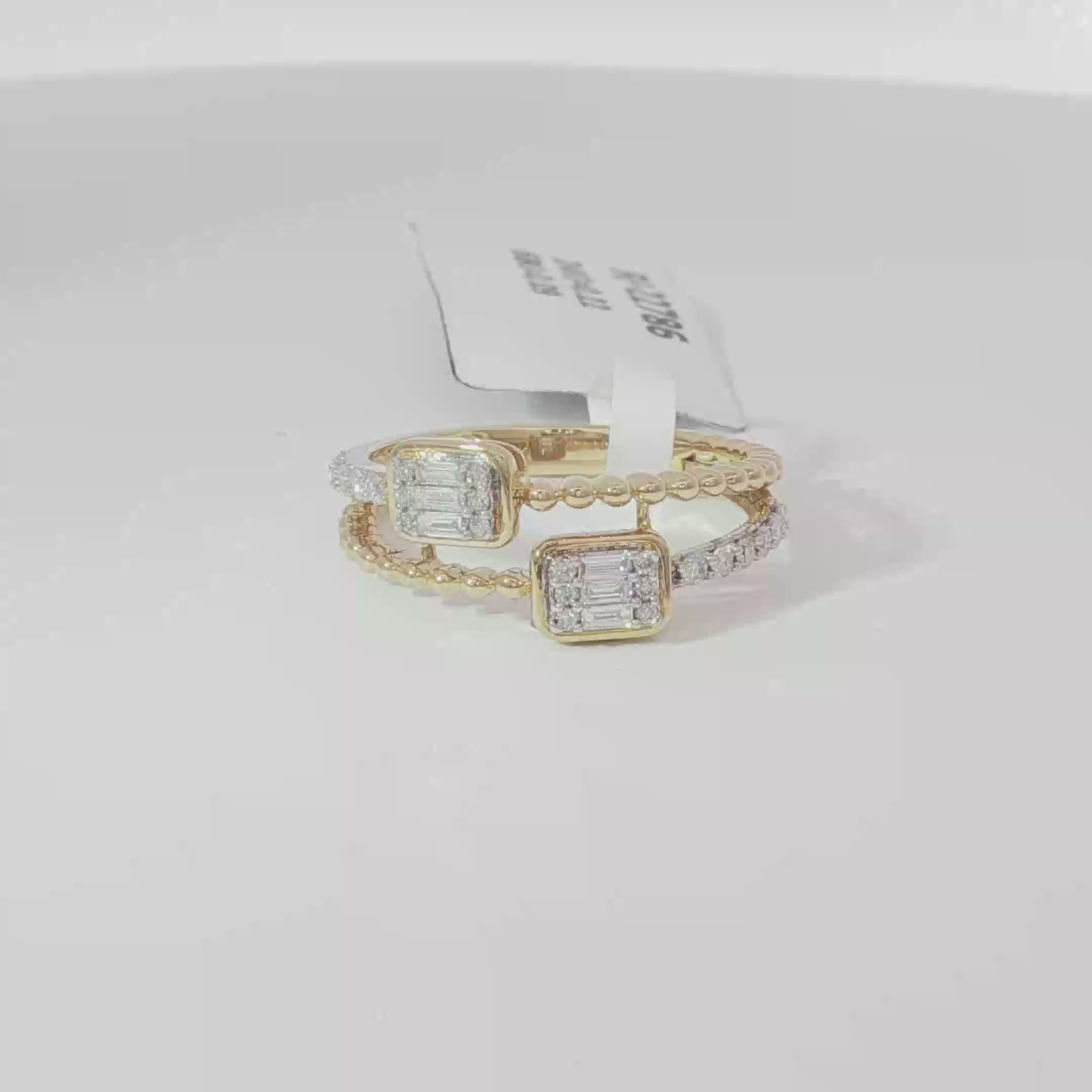 Double emerald diamond ring